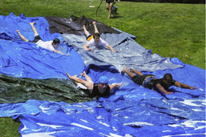 Seniors slide down their self-made slip n slide on JCs football field. 