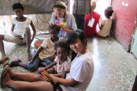 Senior helps at Haitian orphanage
