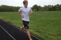 Junior runs barefoot