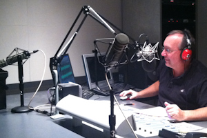 Production Director of CBS Radio Gerry OBrien records a tagline for a commercial.
