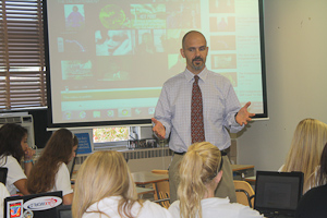 Social studies teacher, Jake Holland, teaches juniors in one of his regular U.S. History classes. After watching a video created by junior Daniel Hentschel, Holland talks to them about the Renaissance 
 and Reformation.