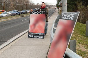 Abortion protesters return to sidewalk outside JC