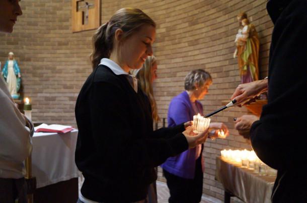 Sophomore Casey Smial is holding a candle in honor of sophomore Rachel DiCamillos father, Jim DiCamillo. Funeral services will be held on Saturday, Oct. 26 at 1 p.m. at St. Margaret Church. 