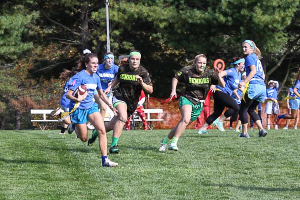 Junior Emory Gaeng runs with the ball in the Powder Puff game. The juniors scored the first touchdown of the game. 