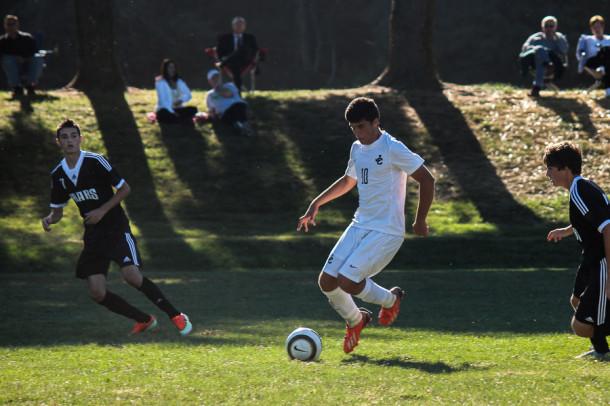 Senior Guillermo Almirall prepares to kick the ball up the field at the Sep. 20 game against St. Pauls. Mens varsity soccers longest streak this year has been four consectutive wins.