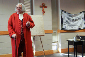 David Fisher, impersonating Ben Franklin, speaks at an event hosted by the History Club. This event, at which 203 students were present, took place Nov. 14.