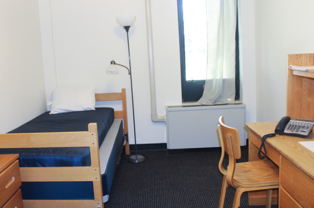 Male students from three different continents now live on campus in refurbished dormitories. Each student has their own room consisting of a bed, sink, desk, and chair.