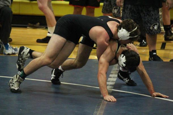 Junior Chris Almony takes down his opponent. Almony has been a part of the team since his freshman year.