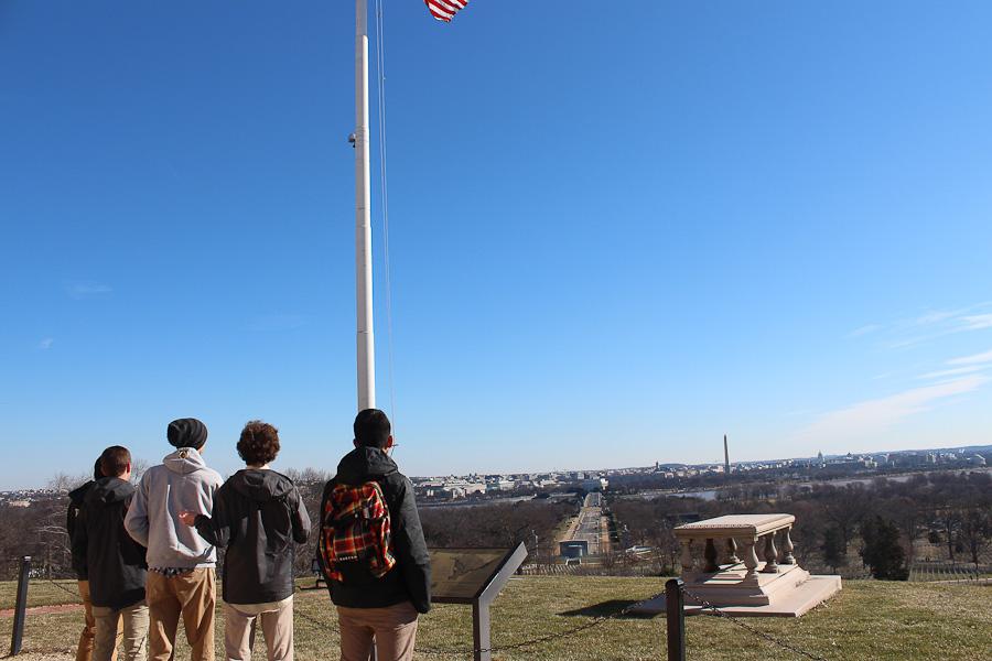Seniors Andrew Tran, Cole Alban, Brenden Hutton, Will Hopkins, and Quasay Multani look out over DC from Arlington National Cemetery. The seniors also visited the Holocaust museum.