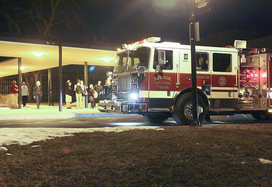 JC students wait outside after the fire alarm was triggered at 6:51 pm on Feb 26. The janitorial crew accidentally set off the alarm with a broom and everyone in the building had to wait outside for fire officials to turn the alarm off.