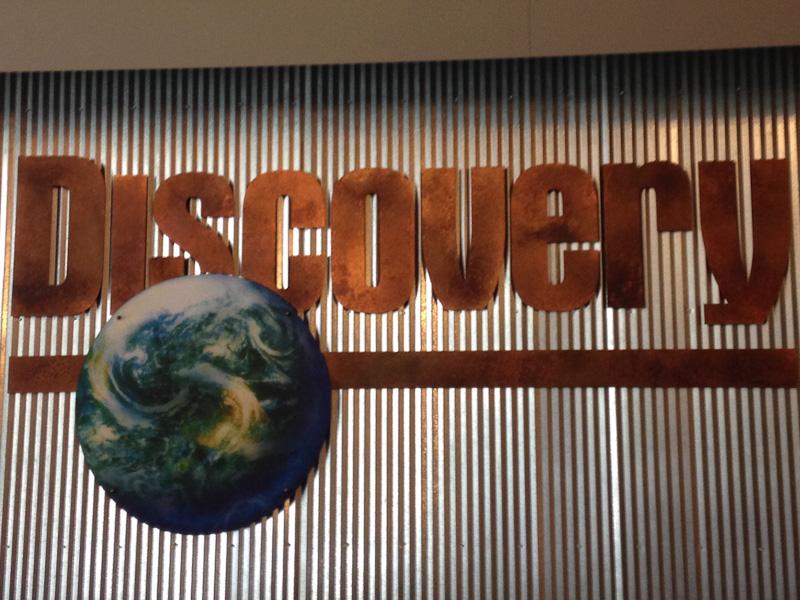 Senior Lauren Fabiszak captures the sign in the front lobby of the Discovery Channel in Silver Spring, Maryland on Monday, March 23rd. Fabizak visited  the Discovery Channel while on a field trip with her Senior Project group.