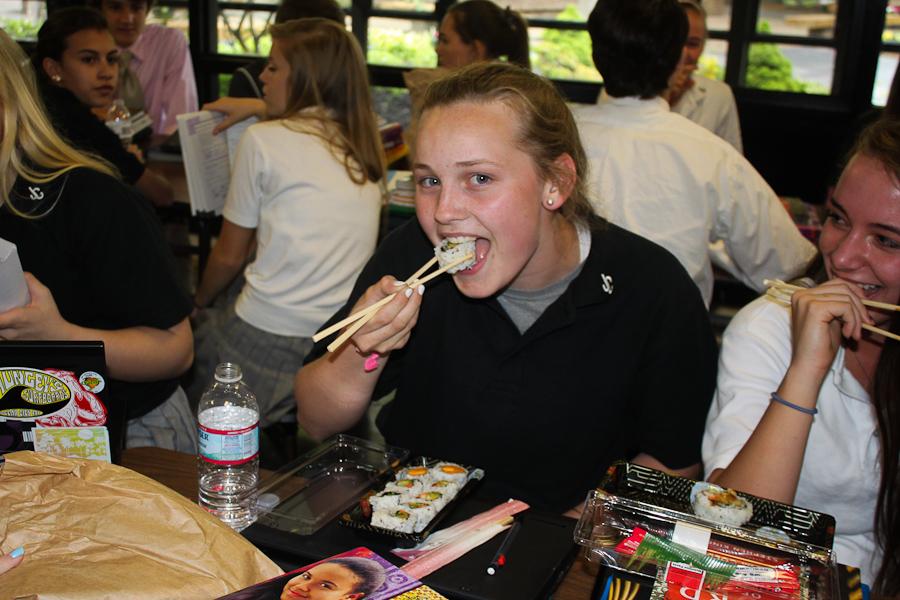 Freshman Jordan Butler eats sushi during mod 8 on May 9. Four different types of sushi were freshly made for students.