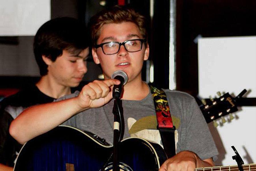 Junior Conrad Gagnon  performs at Dangerously Delicious, a bakery and restaurant in Baltimore, MD, in August 2014. Sketchy Walrus played several original songs at the venue.