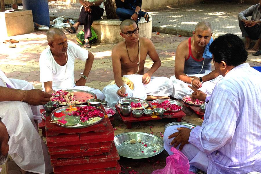 Editor Kishan Patel pays close attention to the Brahmins instructions about the yagna, the spiritual ritual in which Patel took part. Patel went to India in order to be a part of the four hour long yagna to honor his late grandfathers soul.