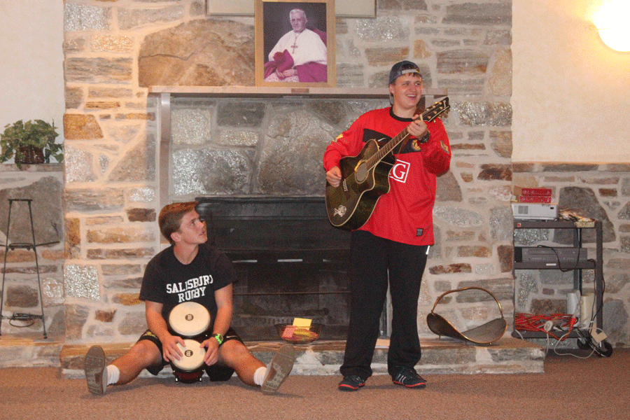 Juniors Adam Mrowiec and Preston Thomson share their musical talents during retreat. The first junior retreat occurred from Oct. 6 to 7.
