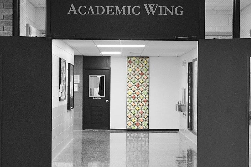 The former door of St. Josephs Hall hangs on the newly built wall in the academic wing. Yu Jin Kim, class of ‘10, turned the old door into a mosaic art piece for her Senior Project.