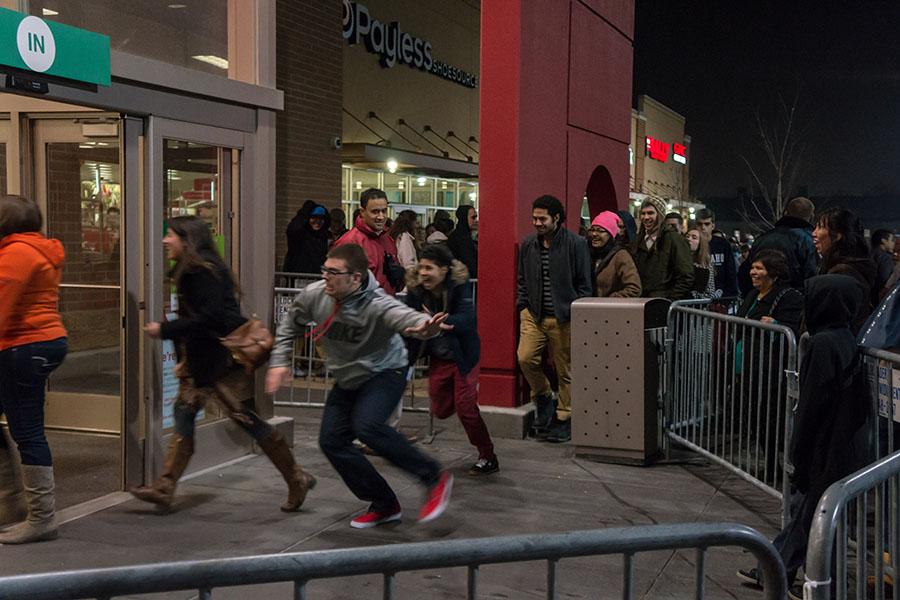 Crowds of eager shoppers storm Target on Black Friday as the doors open. This day has become a phenomena around the world, and kicks off the holiday shopping season.