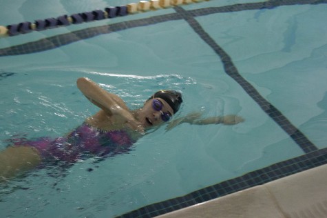 Junior Megan Piercy swims at practice preparing for an upcoming meet. Piercy has been on the swim team for three years.