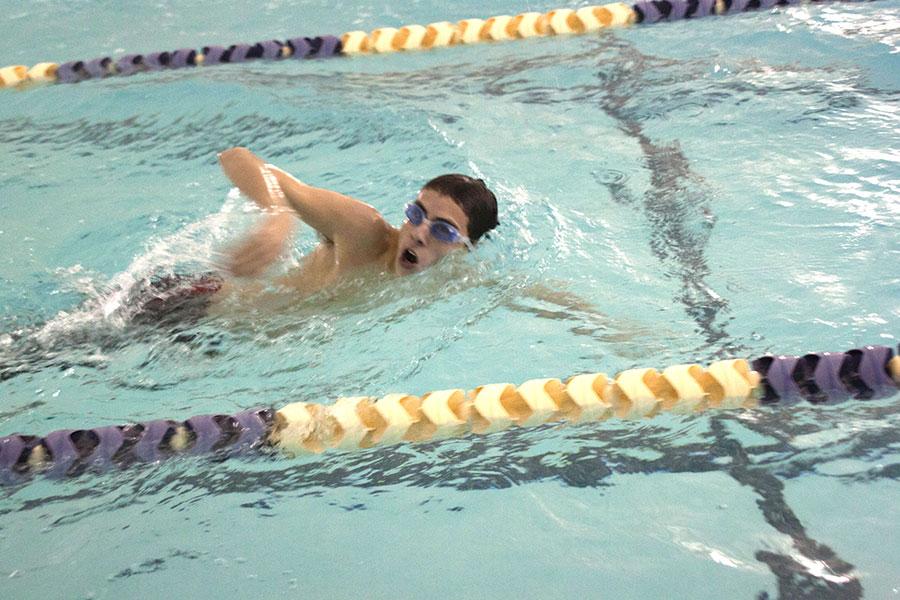 Senior Zack Wedemeyer swims during practice on Tuesday, Dec. 9. The mens swim team has drastically increased in numbers this season compared to last season. 