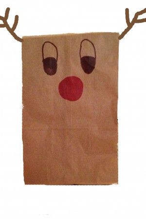 Candy is a staple of Christmas time. To give it as a gift, put it in a personalized brown paper bag.