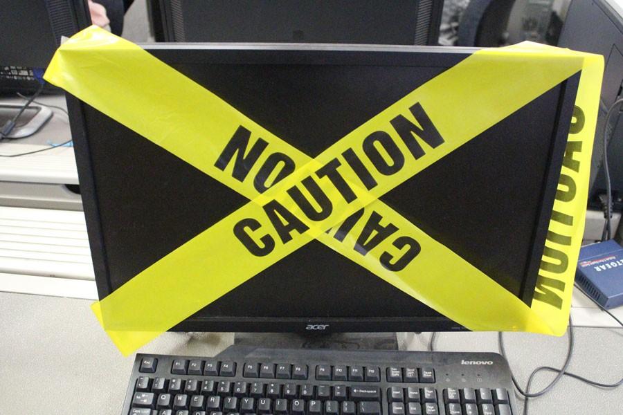This desktop computer is wrapped in caution tape to represent the all the websites that are blocked on the JC network. Over 100 websites are blocked related to games, sports, shopping, entertainment, and online banking.