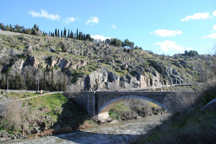 A bridge crosses the Tajo River. This river is the longest river in the Iberian Peninsula.
