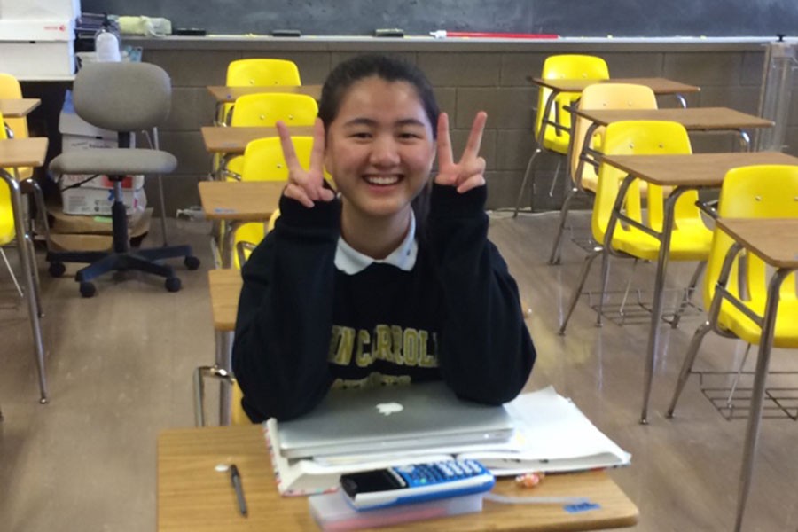 Junior Hebe Wu poses at her desk. Wu and fellow classmates had just finished Pre-Calculus class.