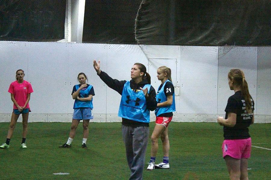 During practice at Maryland Sports Arena, indoor soccer coach Hayley Howe instructs her players on how to effectively pass through opposing defenses. The team lost to Garrison Forest 1-0 at championships Feb. 7.