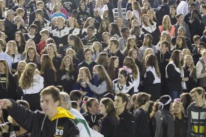 Students show their support for the football team in the student section. The team finished with a record of 5-4. 