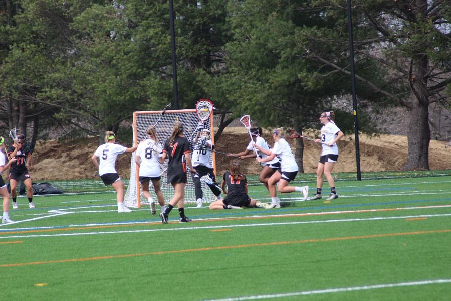 Senior+varsity+goalie+Katy+Sharretts+saves+another+goal+another+goal+in+the+first+game+on+the+new+turf+on+April+7.+The+womens+team+lost+8-6+to+McDonogh%2C+but+has+an+11-4+record+and+will+face+McDonogh+again+in+the+semifinals+on+May+9.+