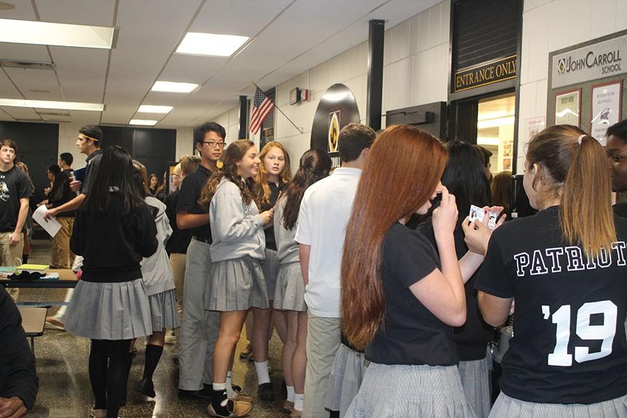 The lunch line extends outside of the entrance door in the first minutes of mod five lunch. This year, the new lunch mods have been a topic of controversy for students, teachers, and administration. 