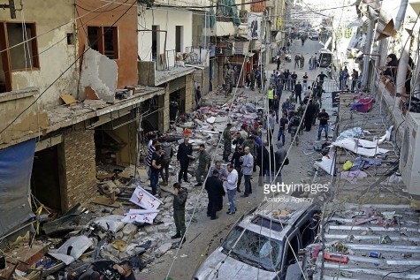 Lebanese people inspect an area where two explosions took place at Dahieh, know as Hezbollah stronghold, South Beirut, Lebanon on November 13, 2015. [A possible 26-35] people were killed and another 180 injured by double bombings.