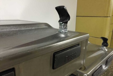 Black duct tape covers the broken water fountains on the third floor. The majority of water fountains throughout the halls are out of order.