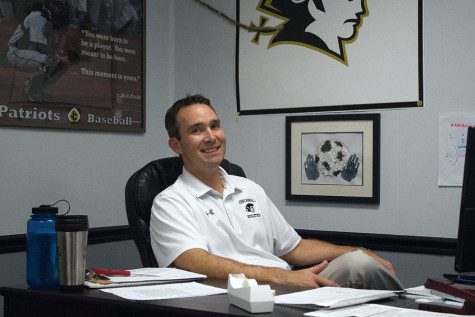 Athletic Director Steve Teter works at his desk. Teter was appointed the Athletic Director Feb. of this year.