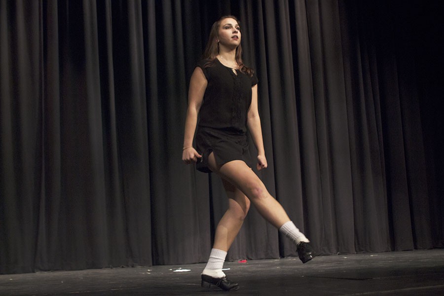 Senior Casey Smial performs an Irish dance routine wearing hard shoes. She has been Irish dancing ever since she was six years old. 