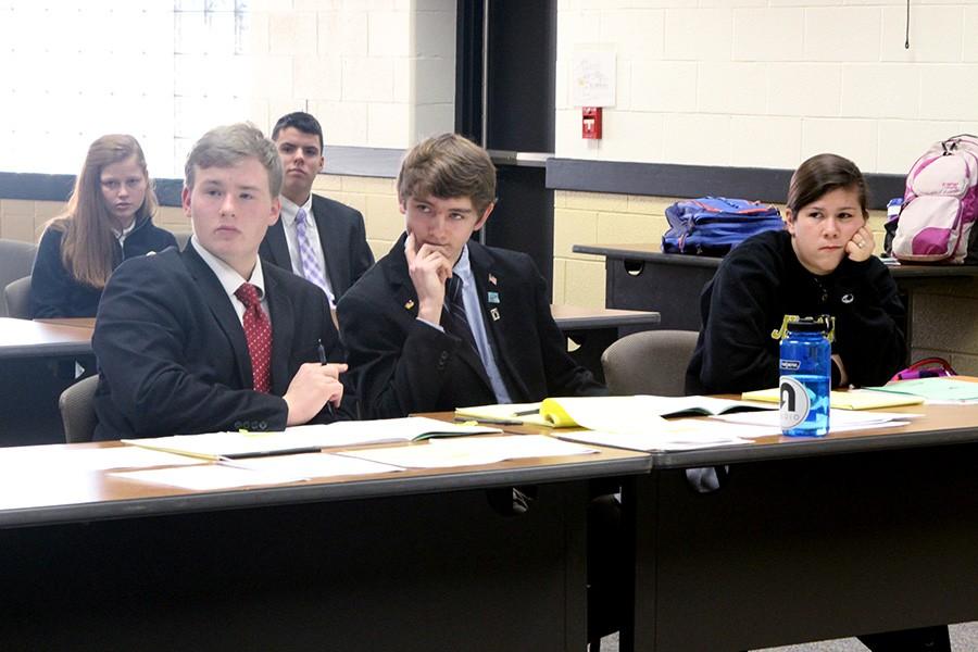 Juniors Caleb Olsen and Edward Benner participate in a Mock Trial scrimmage with senior Alex Kropkowski. The team scrimmaged against one another in preparation for their first trial against Fallston. 
