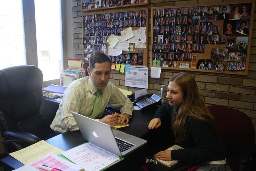 Guidance counselor Larry Hensley helps junior Sydney Shupe plan classes for her senior year. Shupe chose a variety of AP and honors classes to help her prepare for college. 