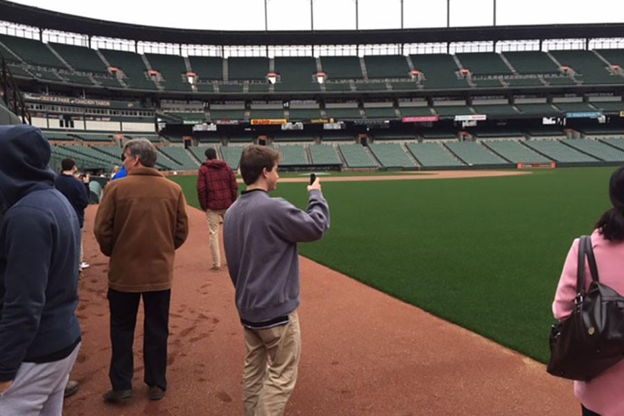 Caption: Senior Dean Laponzina takes in the scene of Camden Yards on an Entrepreneurial Studies class field trip. Laponzina and his class visited Camden Yards Jan. 12 and met with members of the management staff from the Orioles.