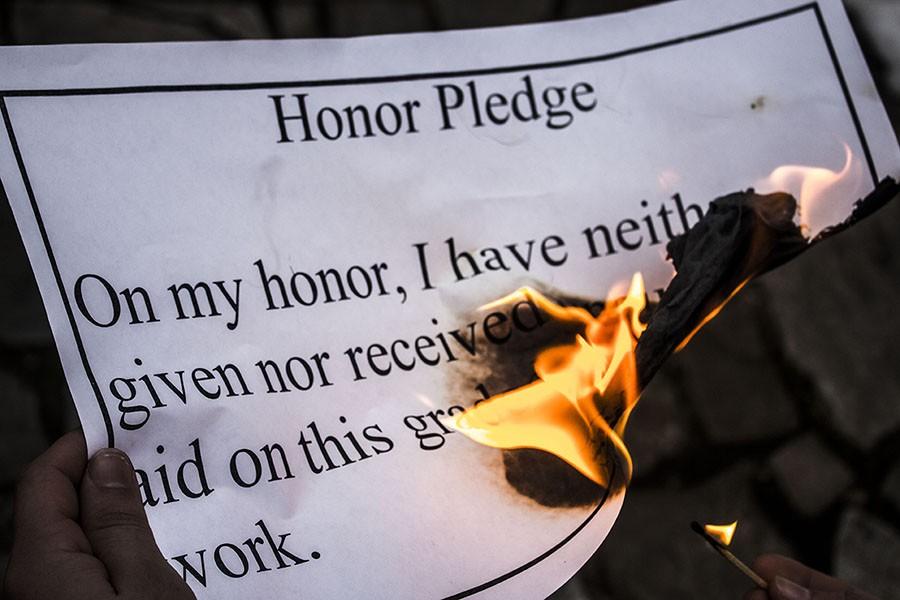 The honor code is too weak to stop the trend of cheating in high schools. In order to keep JC honest a, new, tougher honor code should be adopted. 