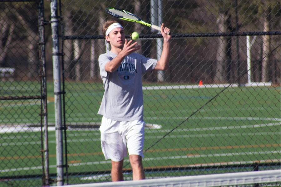 Kevin Smith warms up with slow volleys. Both, Isennock and Smith started playing as a doubles pair last season.