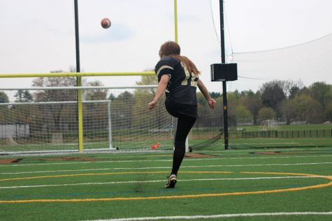 Junior Sarah Meyerl kicks a field goal while wearing the JC football pads. Meyerl aspires to play football her senior year and inspire young girls to play the sports they want regardless of gender. 