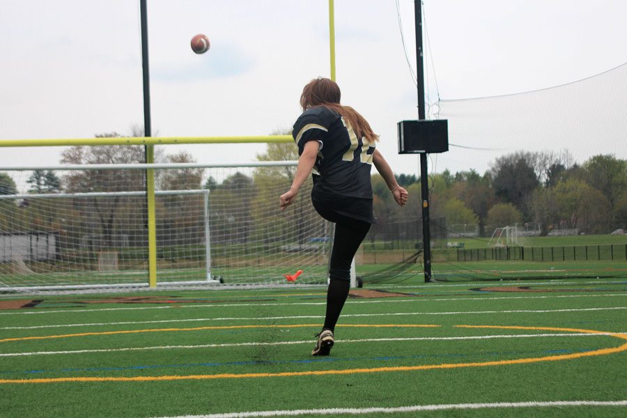 Junior Sarah Meyerl kicks a field goal while wearing the JC football pads. Meyerl aspires to play football her senior year and inspire young girls to play the sports they want regardless of gender. 