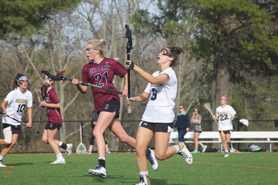 Senior+varsity+women%E2%80%99s+lacrosse+defenseman+Anya+McSorley+passes+the+ball+down+the+field+on+a+fast+break.+McSorley+committed+to+play+lacrosse+at+Coastal+Carolina+University+on+Oct.+of+2014+in+her+junior+year.
