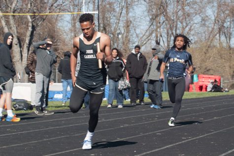 Freshman Ayo Bodison sprints to the finish line during a relay while in a meet against multiple high schools in Maryland. The mens track team capped their successful season off with a MIAA championship.