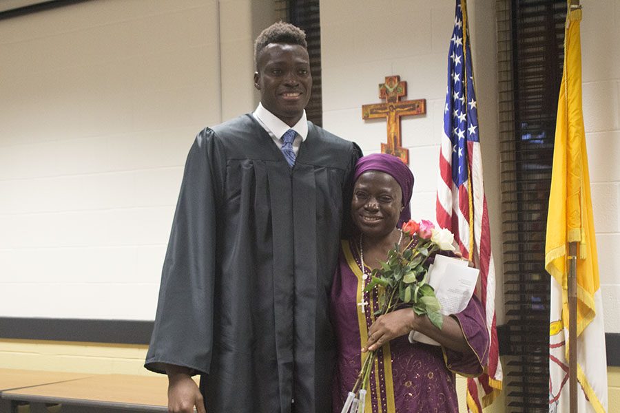 Senior Mike Tertsea poses with his mother, Felicia Ikpum, after the Baccalaureate Mass. With the help of the senior class and faculty members, Ikpum was able to fly from Nigeria in order to reunite with Tertsea and see him receive his diploma. 