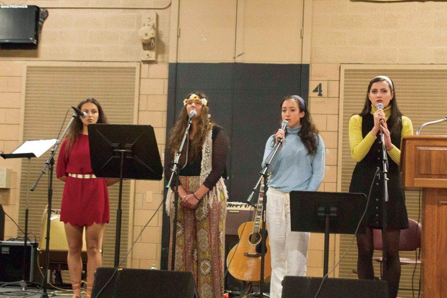 Seniors+Faith+Ensor%2C+Nicolette+Ficca%2C+Hailey+Schilling%2C+and+Lilly+Stannard+perform+during+the+Peace+and+Justice+Assembly+on+April+6.+The+Assembly+featured+singing+and+speeches+from+students+and+faculty+about+inclusivity%2C+discrimination%2C+and+diversity.