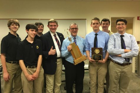 The Academic Team poses with the trophy from the Harford County Championships. On April 26, the Academic Team won the championships in a sudden-death round  against C. Milton Wright. 