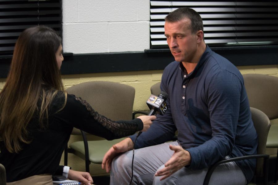 ABC2 News reporter Mallory Sofastaii interviews Chris Herren during a press conference. Herren came to speak at John Carroll about his recovery from addiction on May 18.