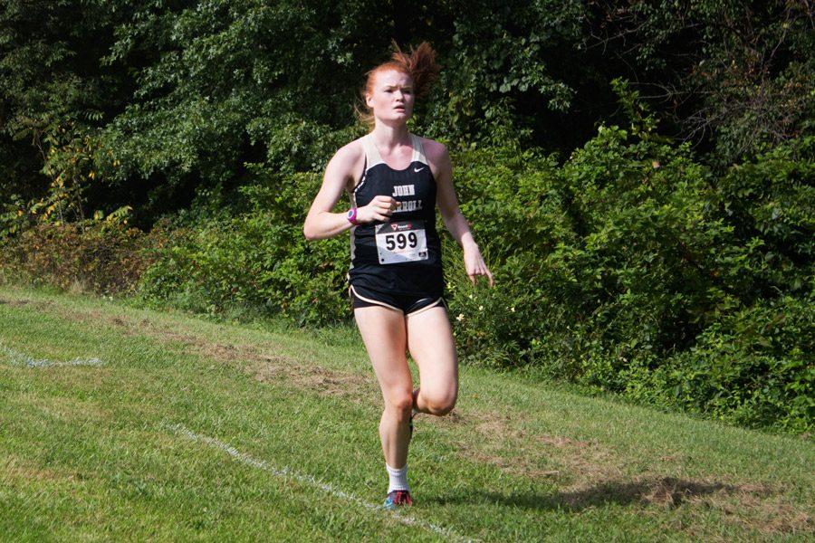 Junior Rosemary Gillam digs deep on the final stretch as she races in the Mustang Invitational, a two-mile course, on Sept. 2. Gillam won third place overall and was JCs top runner with a time of 12 minutes and 27 seconds.
