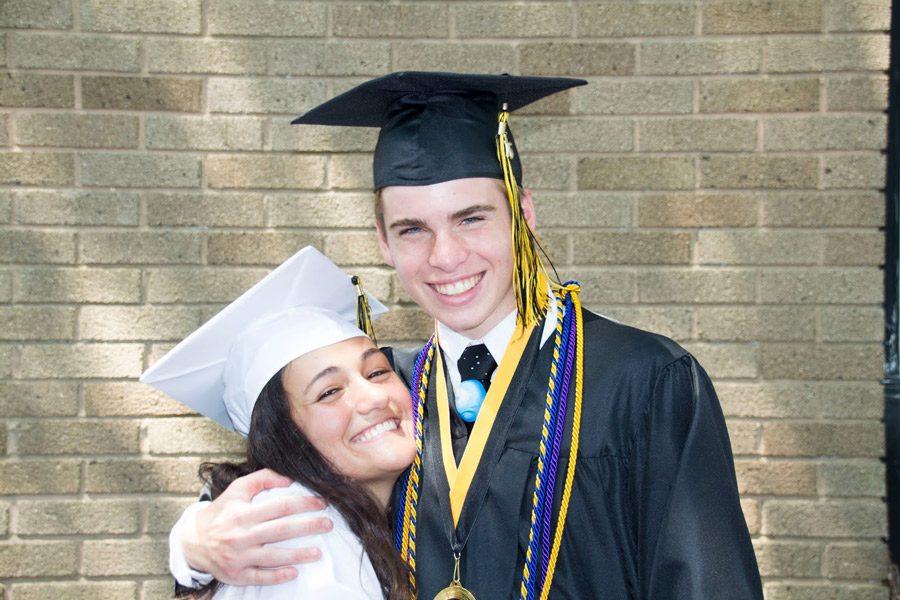 Claire Grunewald and Mitchell Hopkins, class of 16, pose together after the graduation celebration on May 28, 2016. Grunewald and Hopkins were selected as finalists for the National Scholastic Press Association’s 2016 Newspaper Page One Design of the Year award for The Gun Issue, which was published in Nov. 2015.
